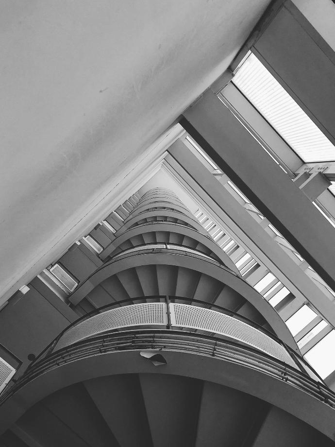 grayscale photo of spiral staircase