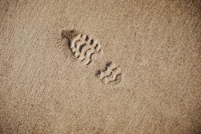 selective focus photography of foot print
